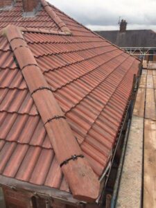 removal of old slate roof supplied and fitted a composite slate. new dry ridge 12
