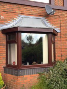 rosewood fascia with white and rosewood soffit new gutters and dry verge 07 07